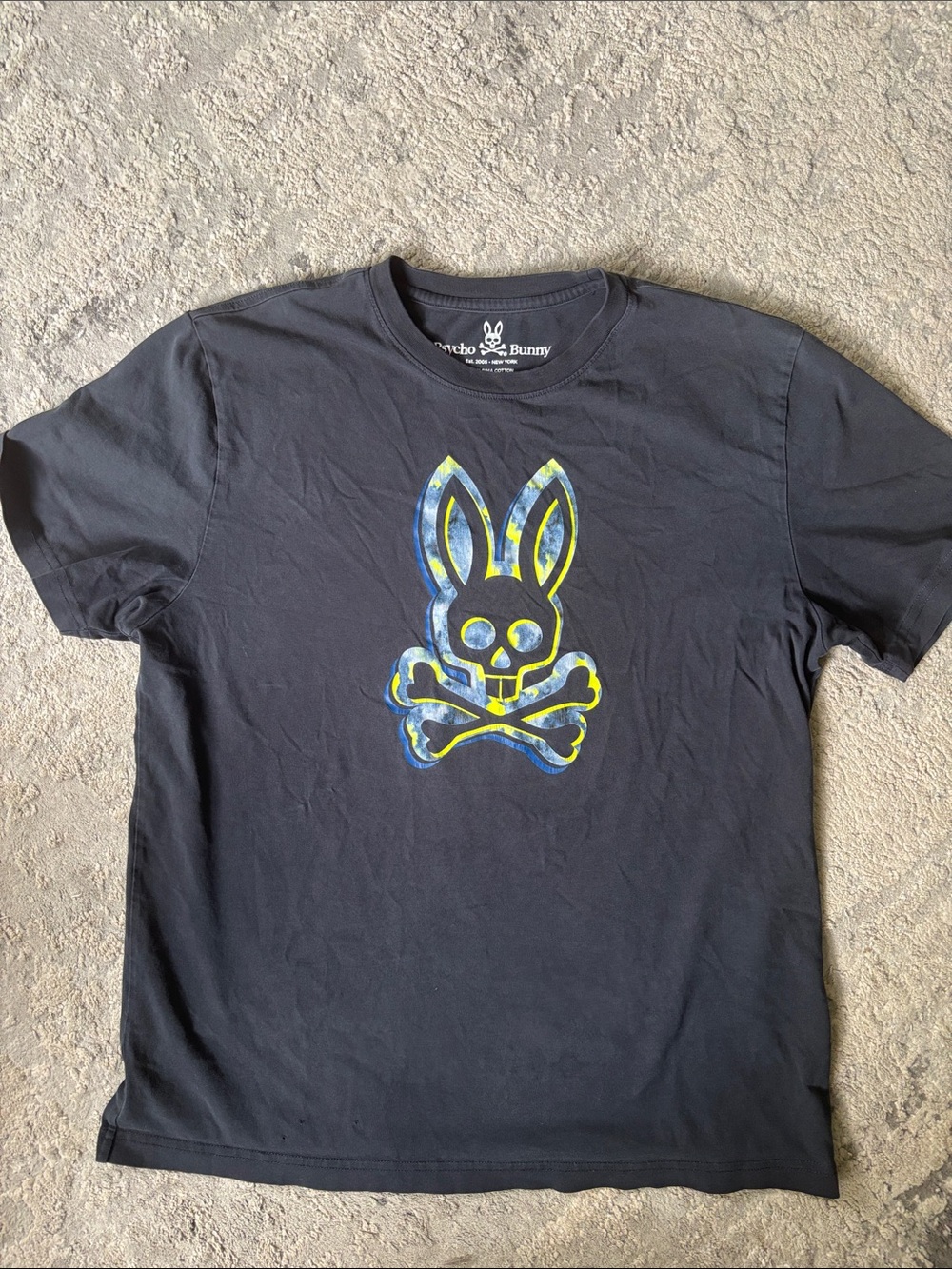 Psycho Bunny Black Tee with Blue and Yellow Bunny Skull Graphic